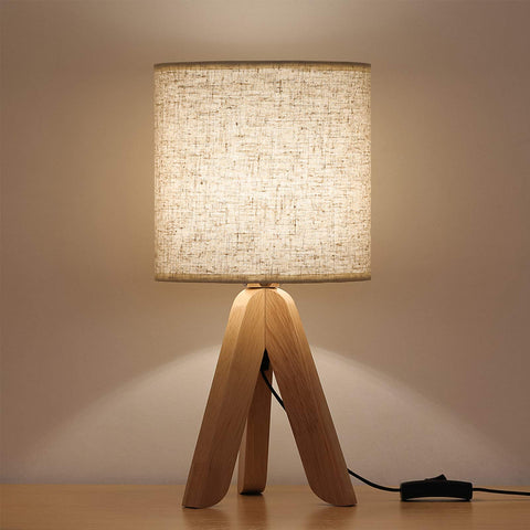 HAITRAL small bedside lamp with wooden tripod base for warm ambience.