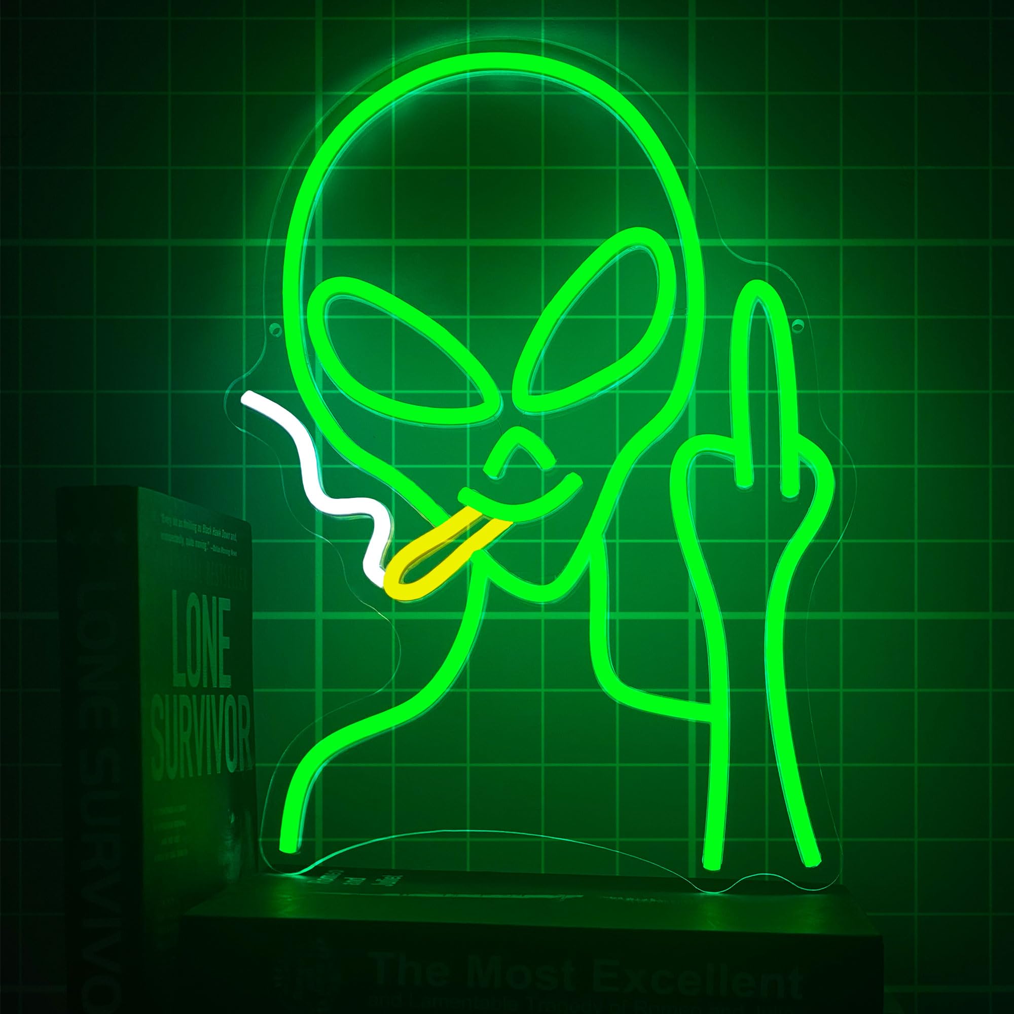 HAJAE green alien neon sign illuminating a wall as decor