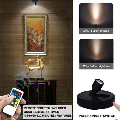 HAMVIDNE puck light with dimmer showcases artwork on shelves with warm white glow.