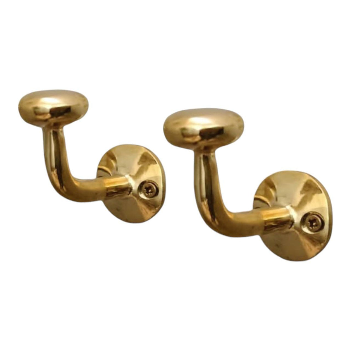 HANDLUX unlacquered brass wall hook holding coats with vintage charm