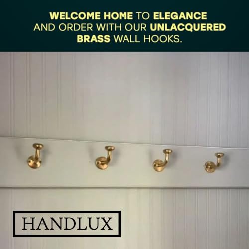 HANDLUX unlacquered brass wall hook holding towels neatly