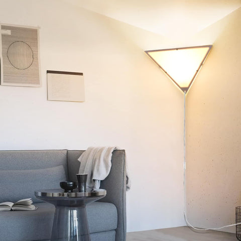 Haultop corner light triangle frame emits soft ambient glow in living room.