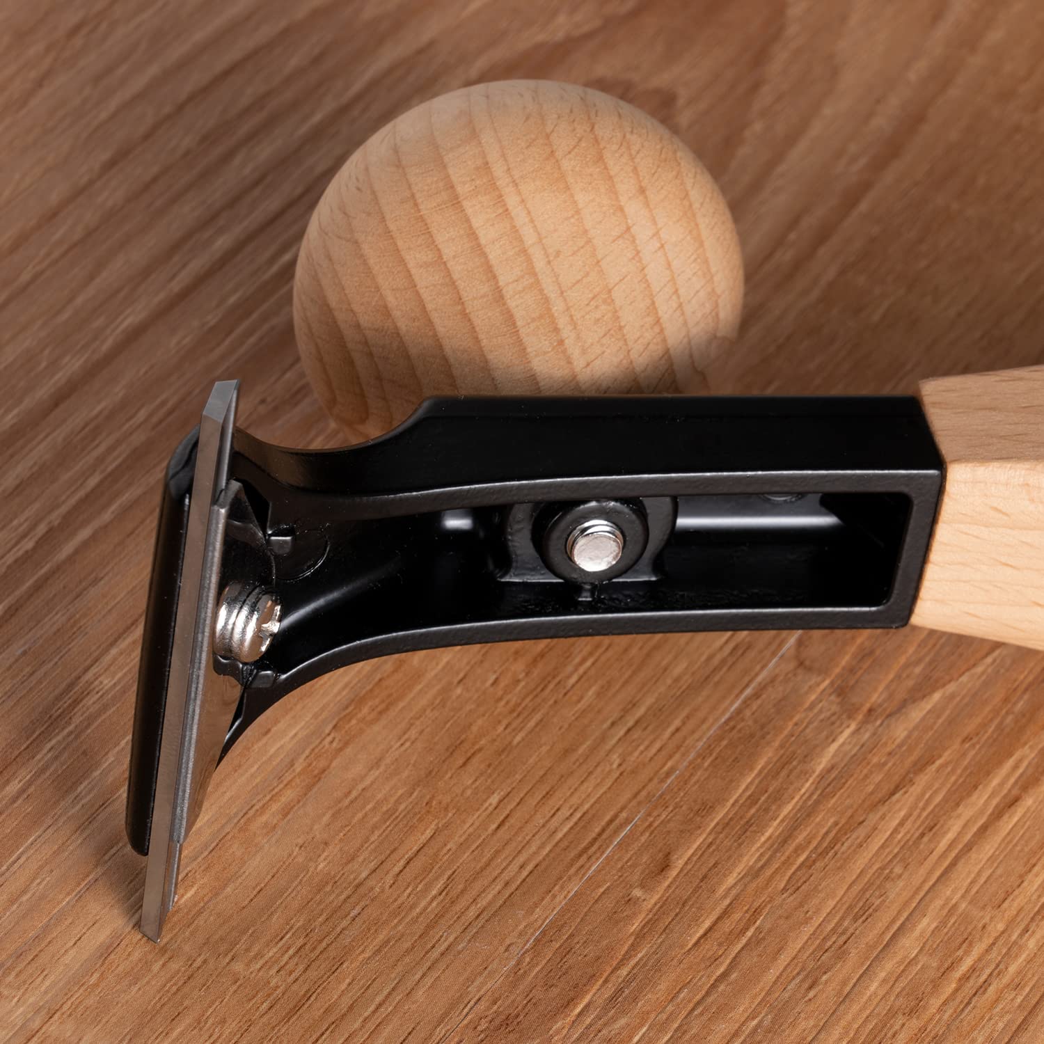 Hazztoll ergonomic beech handle shown for comfortable scraping grip.