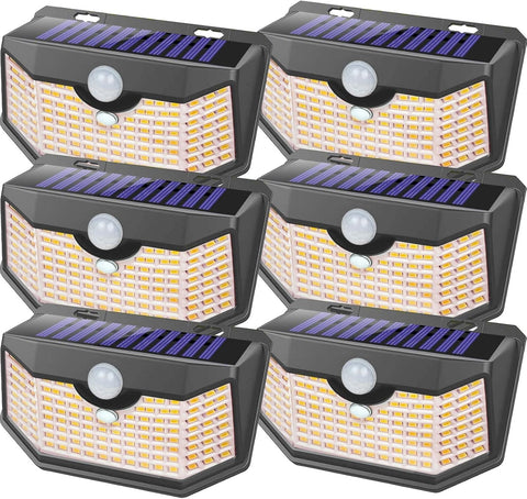 HMCITY 120 LED outdoor solar light with motion sensor lighting a walkway.