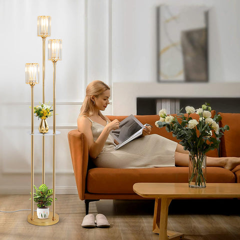 HMVPL gold floor lamp lower shelf keeps essentials at hand.
