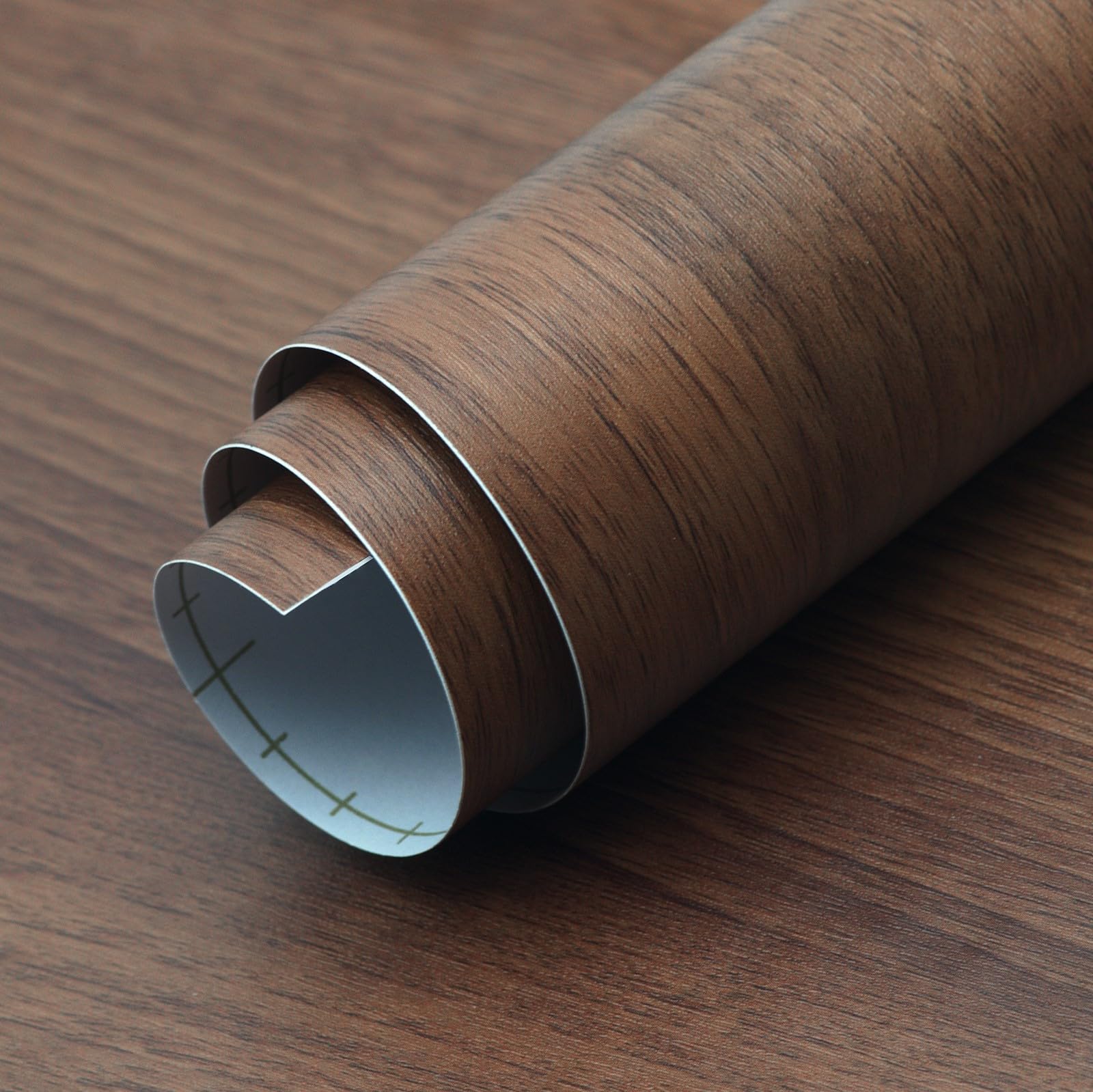 HOLOMEY peel-and-stick back shows easy, bubble-free adhesion on flat surfaces