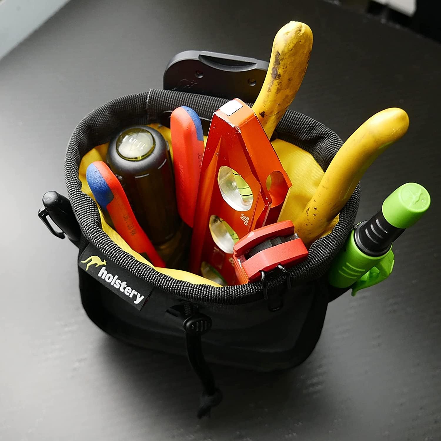 Cinch-top feature of Holstery Joey Pouch Pro secures hardware when moving.