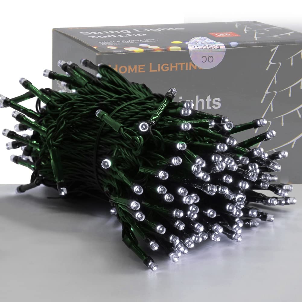 HOME LIGHTING 66ft white LED string lights brighten an outdoor hedge with warm glow