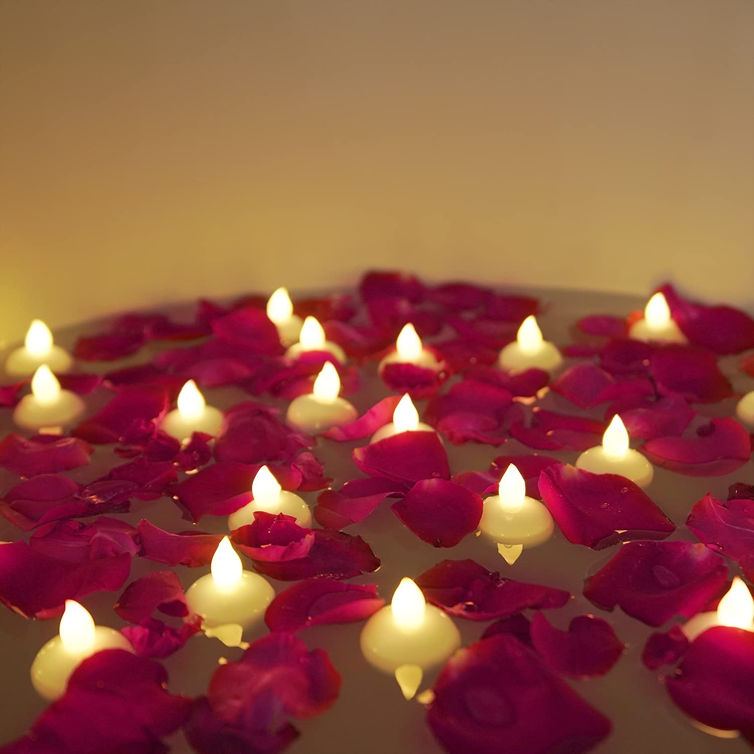 Homemory floating tealight with dried rose petals for water centerpieces.