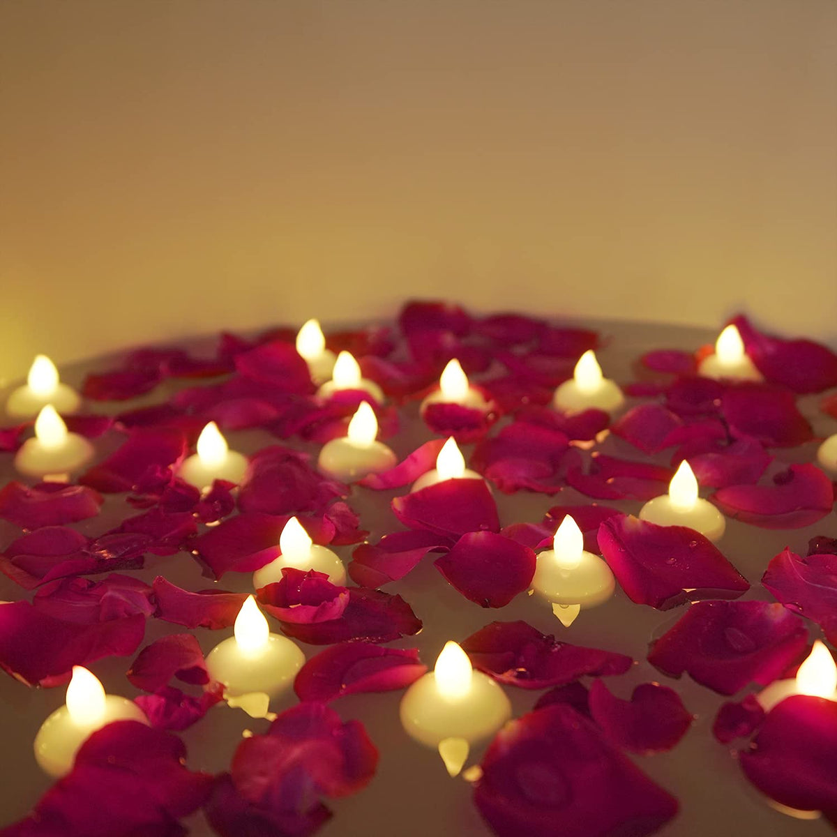 Homemory floating tealight with dried rose petals for water centerpieces.
