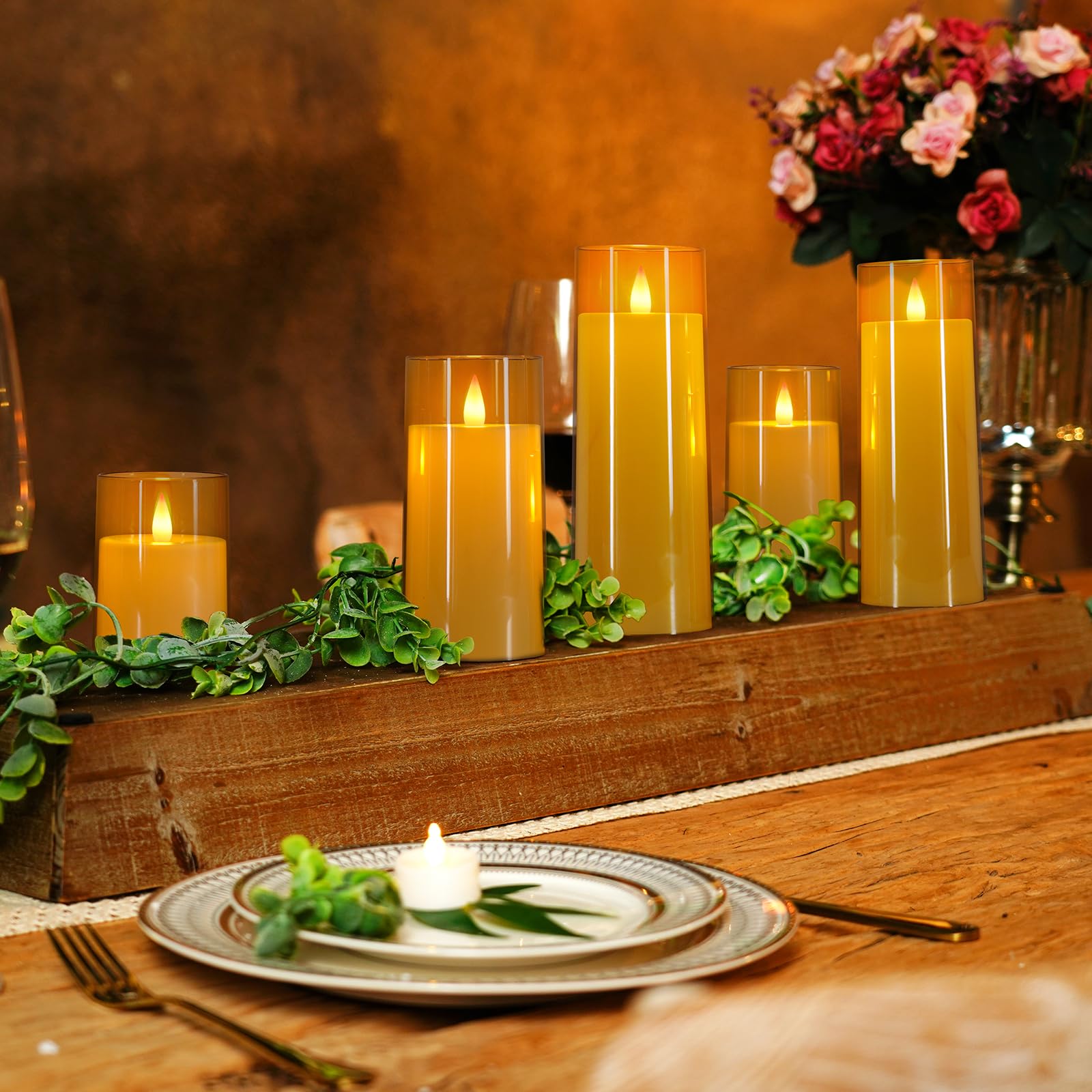 Homemory gold flameless candles on bedside table with soft glow.