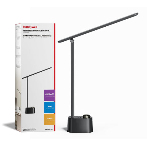 Honeywell H01 Pro Sunturalux foldable desk lamp on a compact, organized desk.