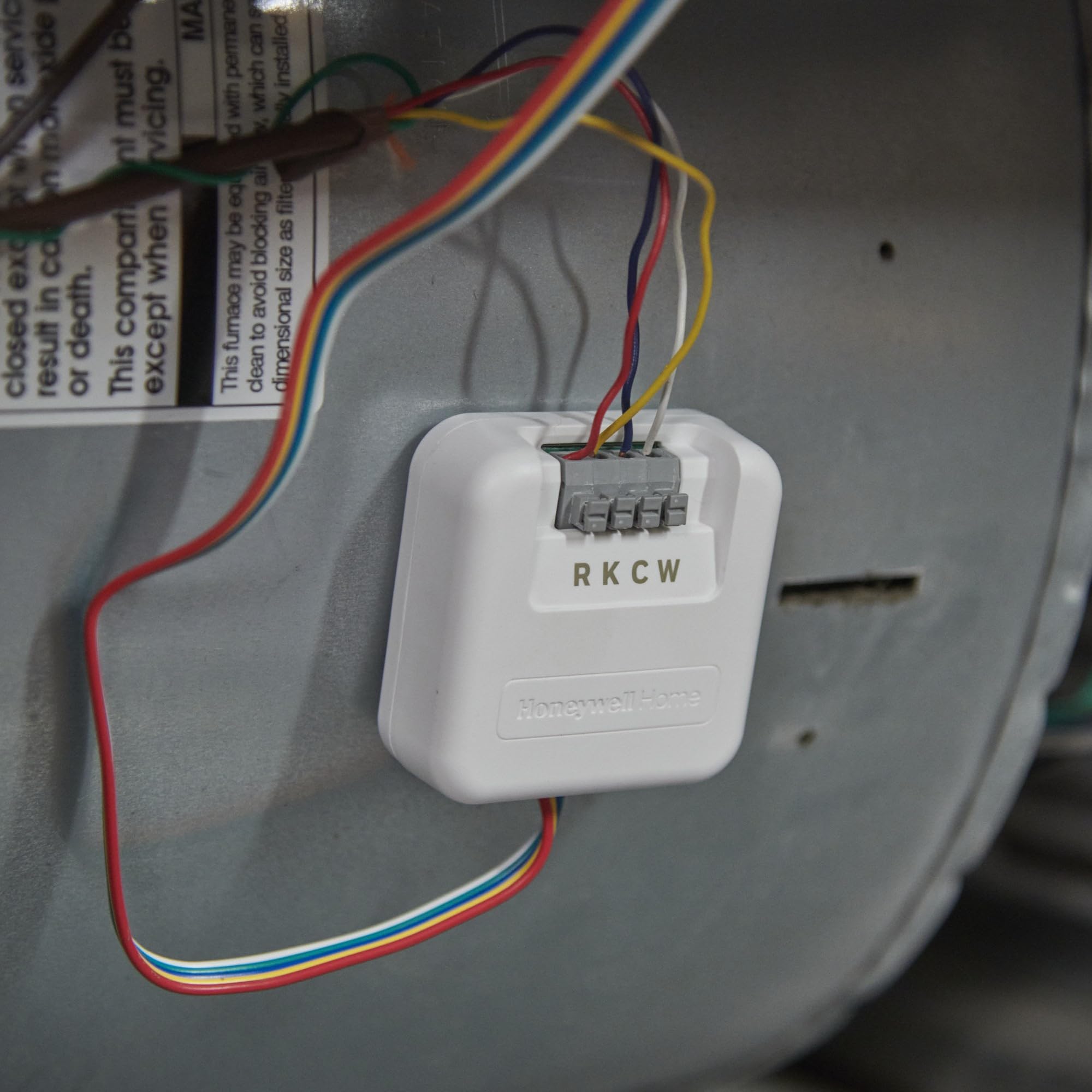 Honeywell Home C-Wire Adapter powering a Wi-Fi thermostat without a common wire.