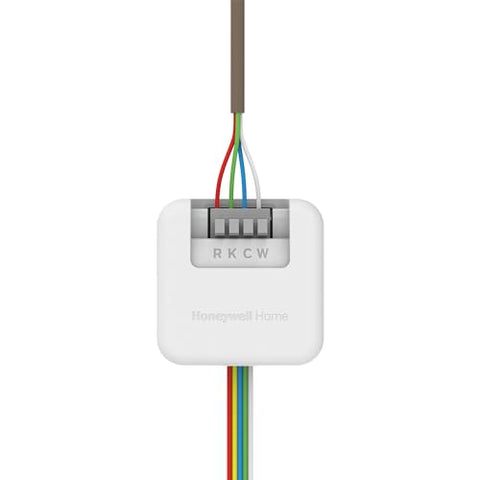 Honeywell Home C-Wire Adapter backplate mounted to furnace exterior.