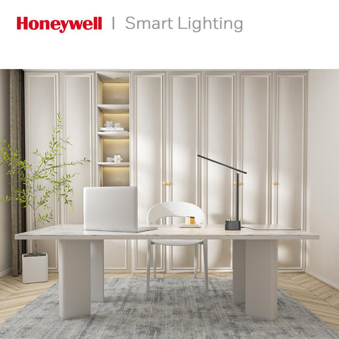 Bedside reading with Honeywell Sunturalux lamp providing steady illumination.