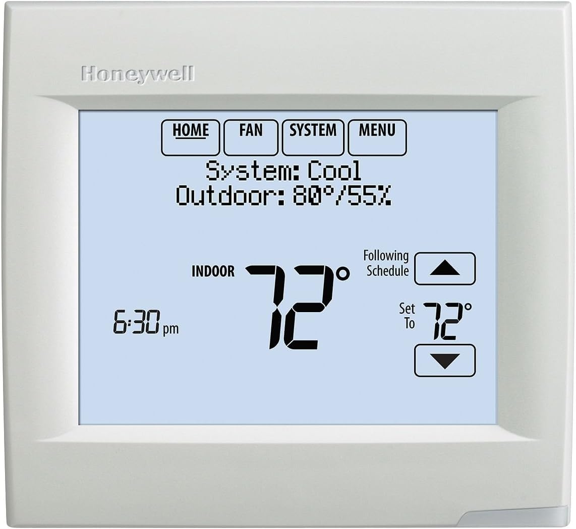 Honeywell VisionPRO 8000 thermostat mounted in a modern interior with a white finish.