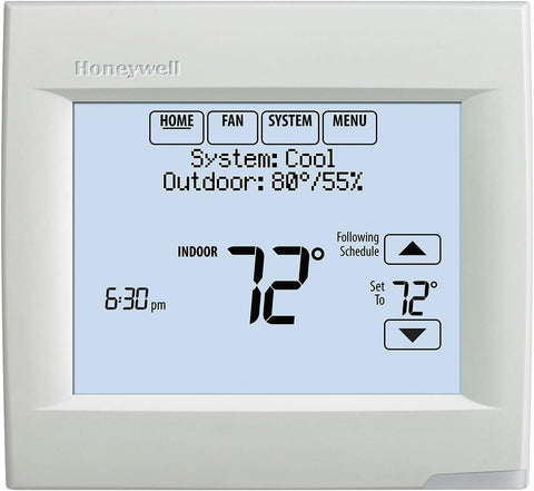 Honeywell VisionPRO 8000 thermostat mounted in a modern interior with a white finish.