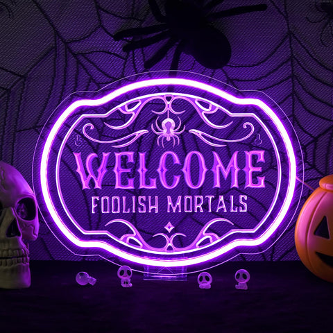 Horseneon Welcome Foolish Mortals sign front-lit for spooky entryway ambiance.
