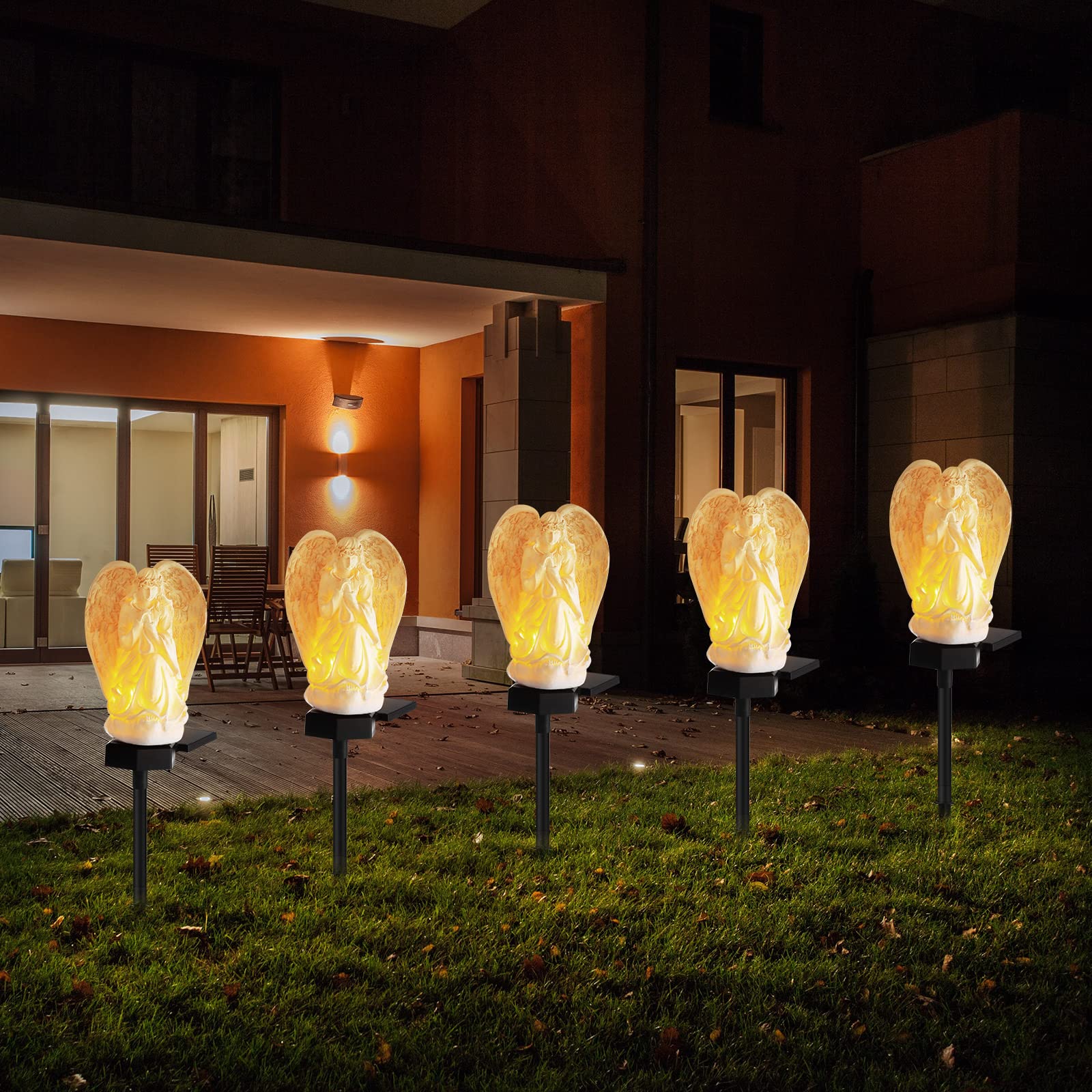 Hortsun elegant angel solar light adds warm ambience to yard.