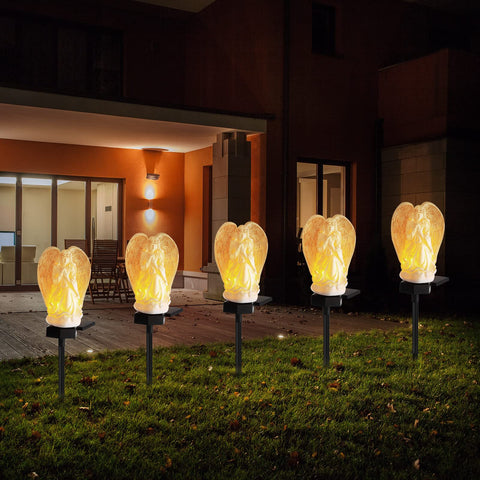 Hortsun elegant angel solar light adds warm ambience to yard.