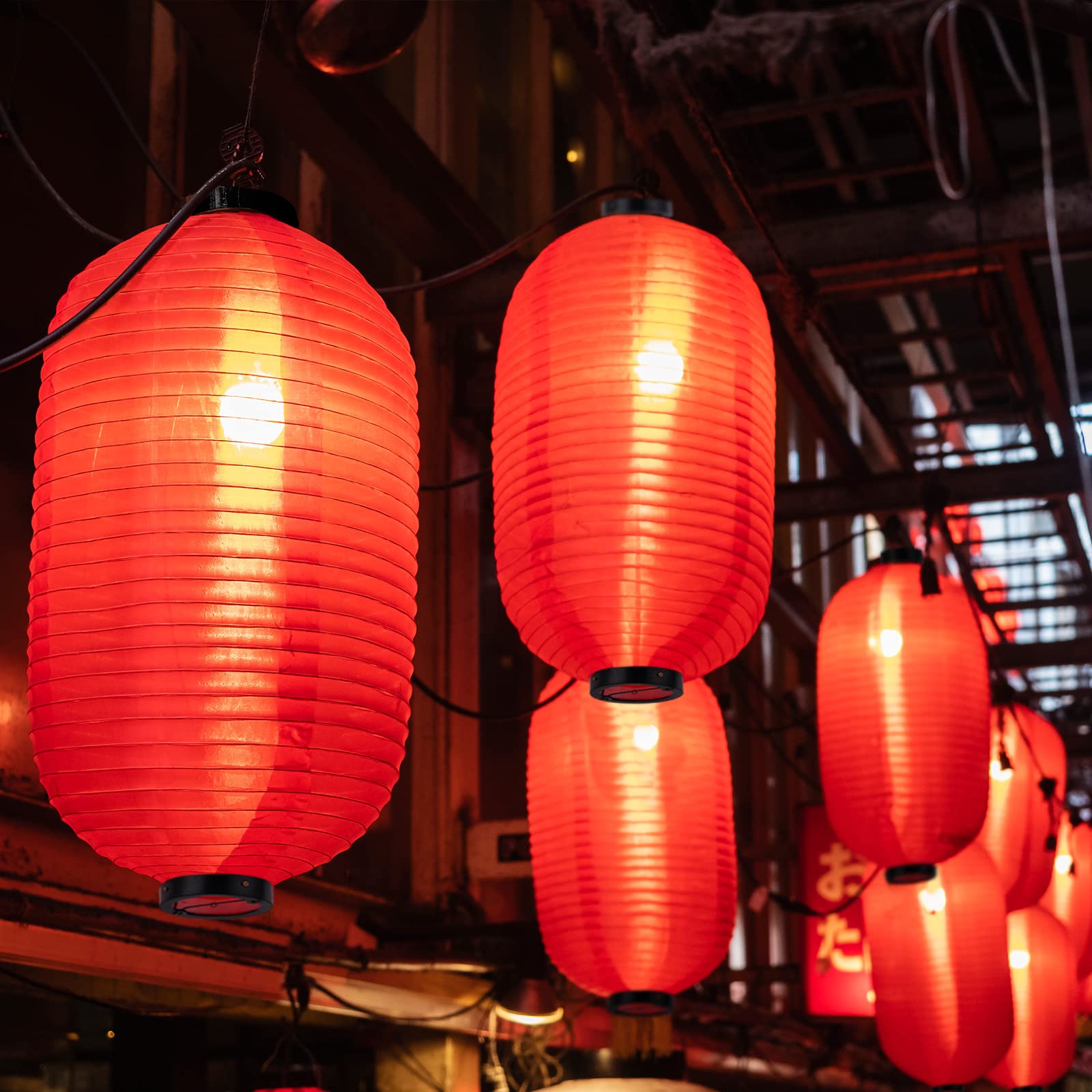 Hortsun lanterns outdoors in garden, warm lights enhancing evening ambiance.