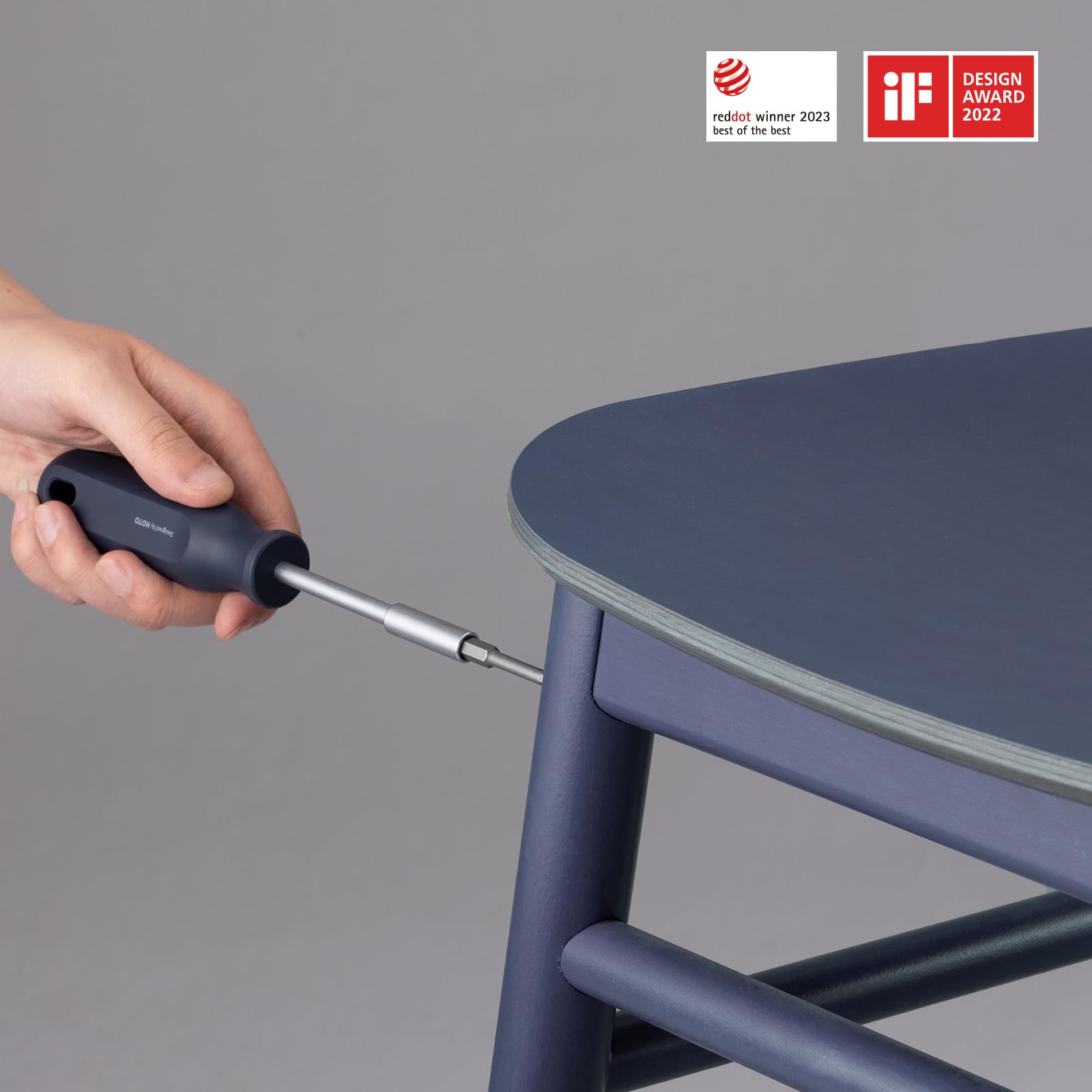 HOTO claw hammer with rubber cap protecting surfaces during tasks.