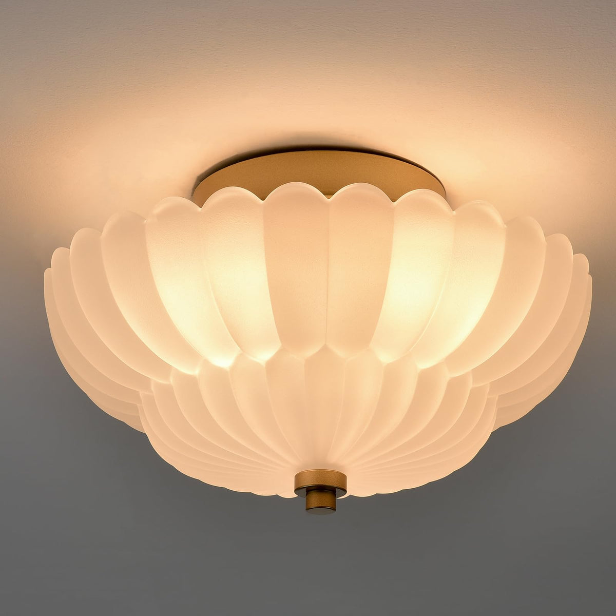HYDELITE gold flush mount with milk white shade for soft, diffused bath lighting.