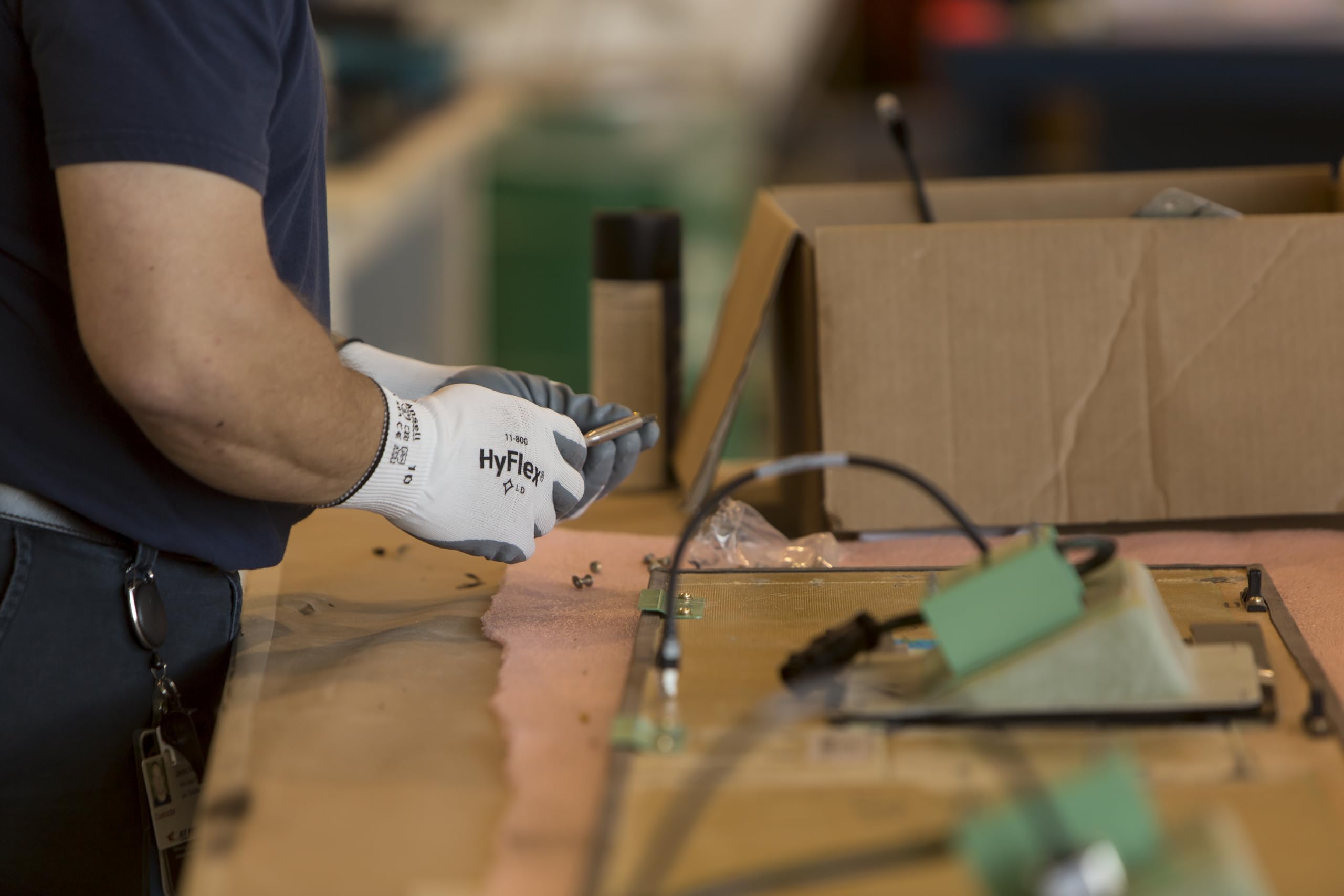 Gloves used in automotive workflow with HyFlex 11-800 for maintenance