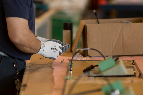 Gloves used in automotive workflow with HyFlex 11-800 for maintenance