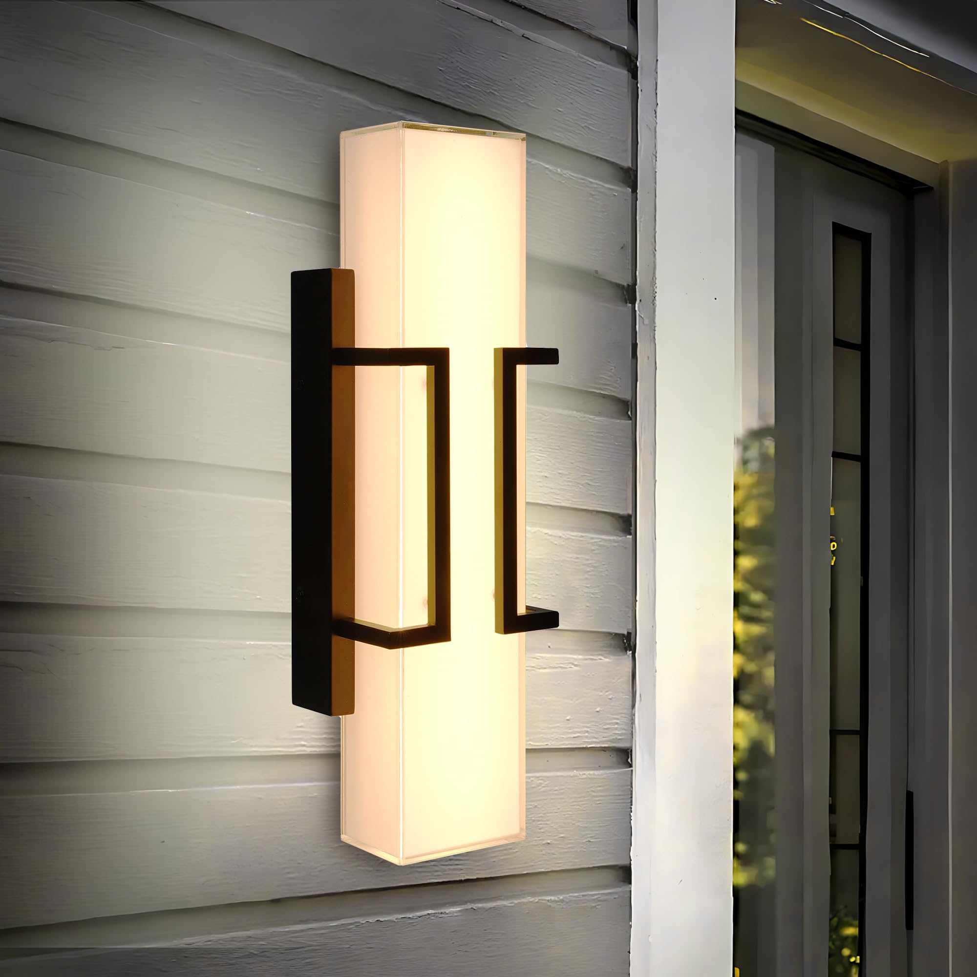 Hyunbae wall sconce emits inviting warm glow across exterior spaces.