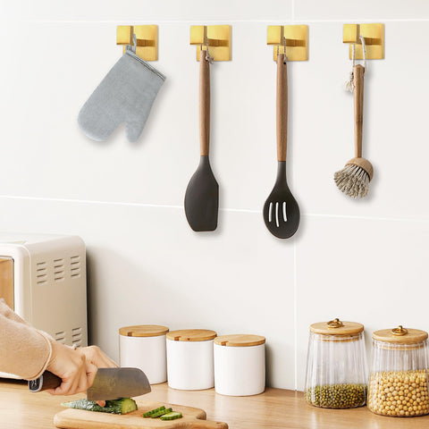 IBosins brushed gold towel coat hook complements bathroom decor.