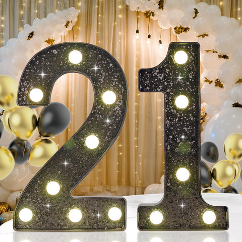 IFDGCTK 21st birthday LED light with black glitter finish for a dramatic centerpiece.
