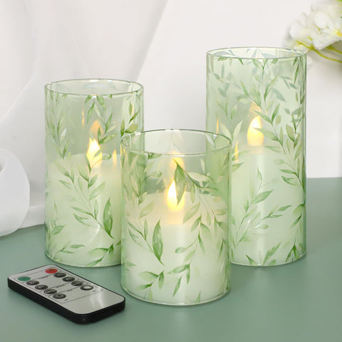 Immeiscent glass flameless candle with willow leaf wrap for lifelike ambient décor.