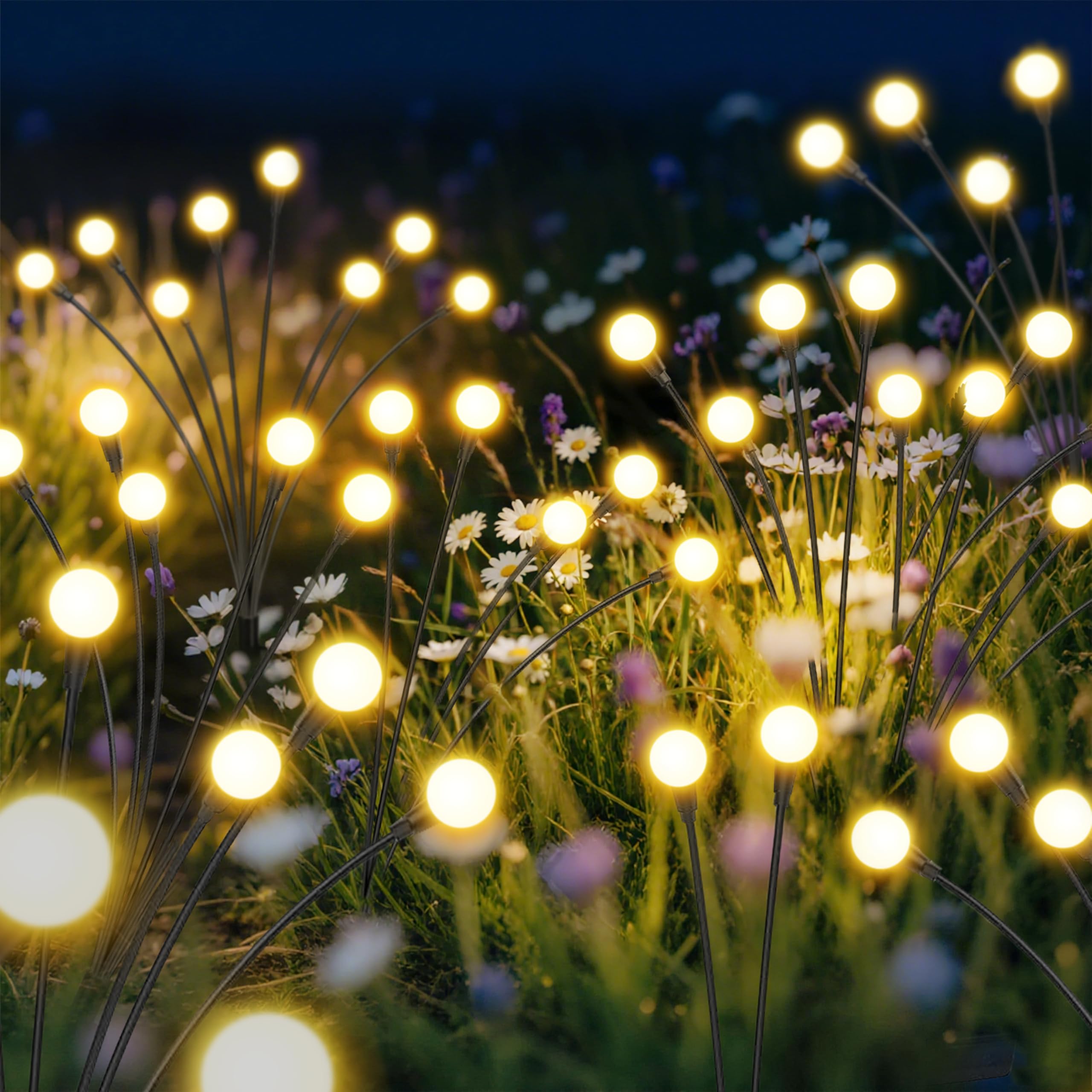 inBoboli Solar Firefly Lights cast warm white glow along a patio, creating inviting evenings.