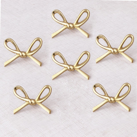 Indian Shelf brass gold bow knob closeup highlights premium finish for cabinets