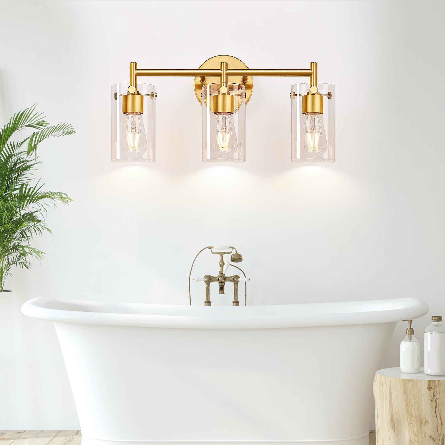 Indoi closeup of the brushed gold finish on a 3-light vanity fixture