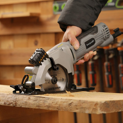 Inequalit mini circular saw with rip guide for straight, guided cuts.