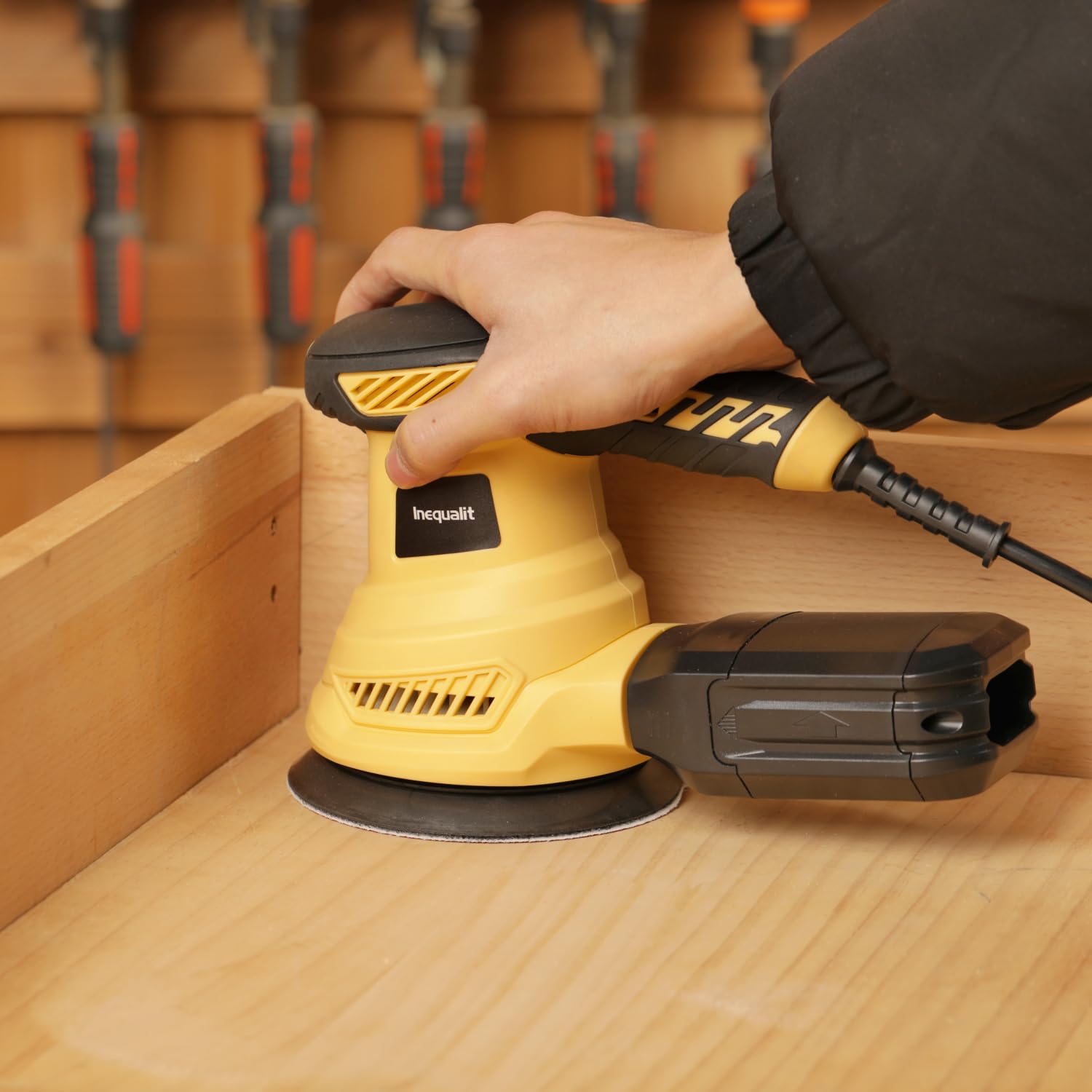 Inequalit Random Orbital Sander dust collection bag for easy cleanup.