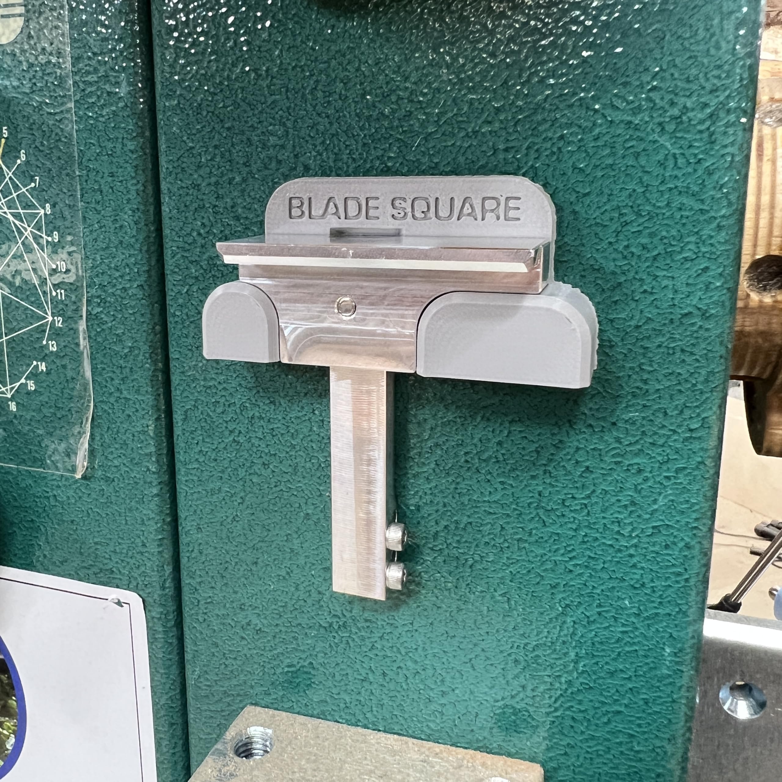 INKLEIND Blade Square magnetic attachment on bandsaw blade for precise angle reference.