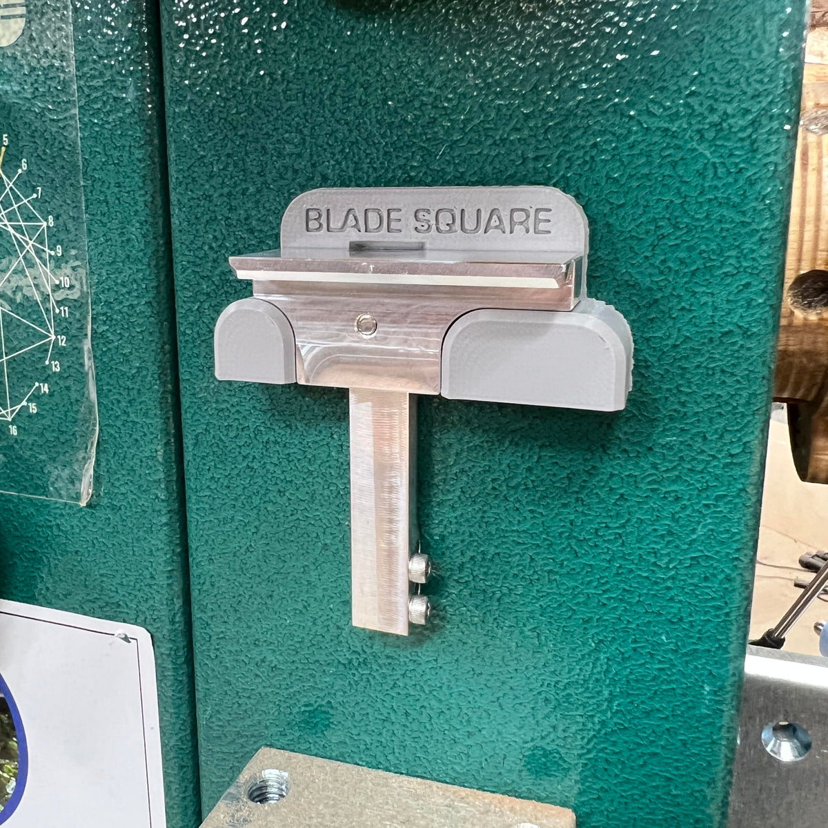 INKLEIND Blade Square magnetic attachment on bandsaw blade for precise angle reference.