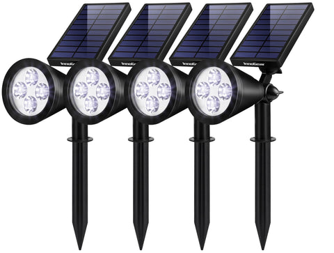 InnoGear solar spotlight brightens a flag for nighttime visibility.