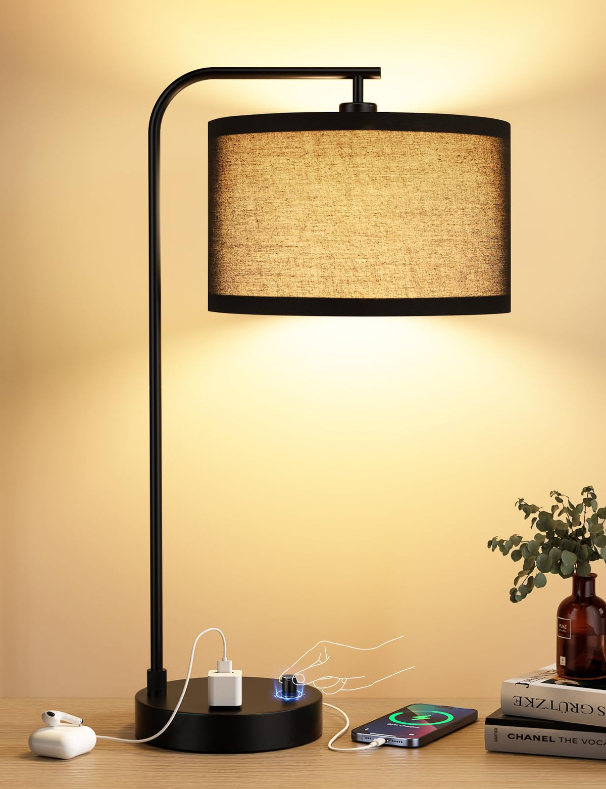 Innqoo black tall table lamp with USB ports and outlet for bedside charging.