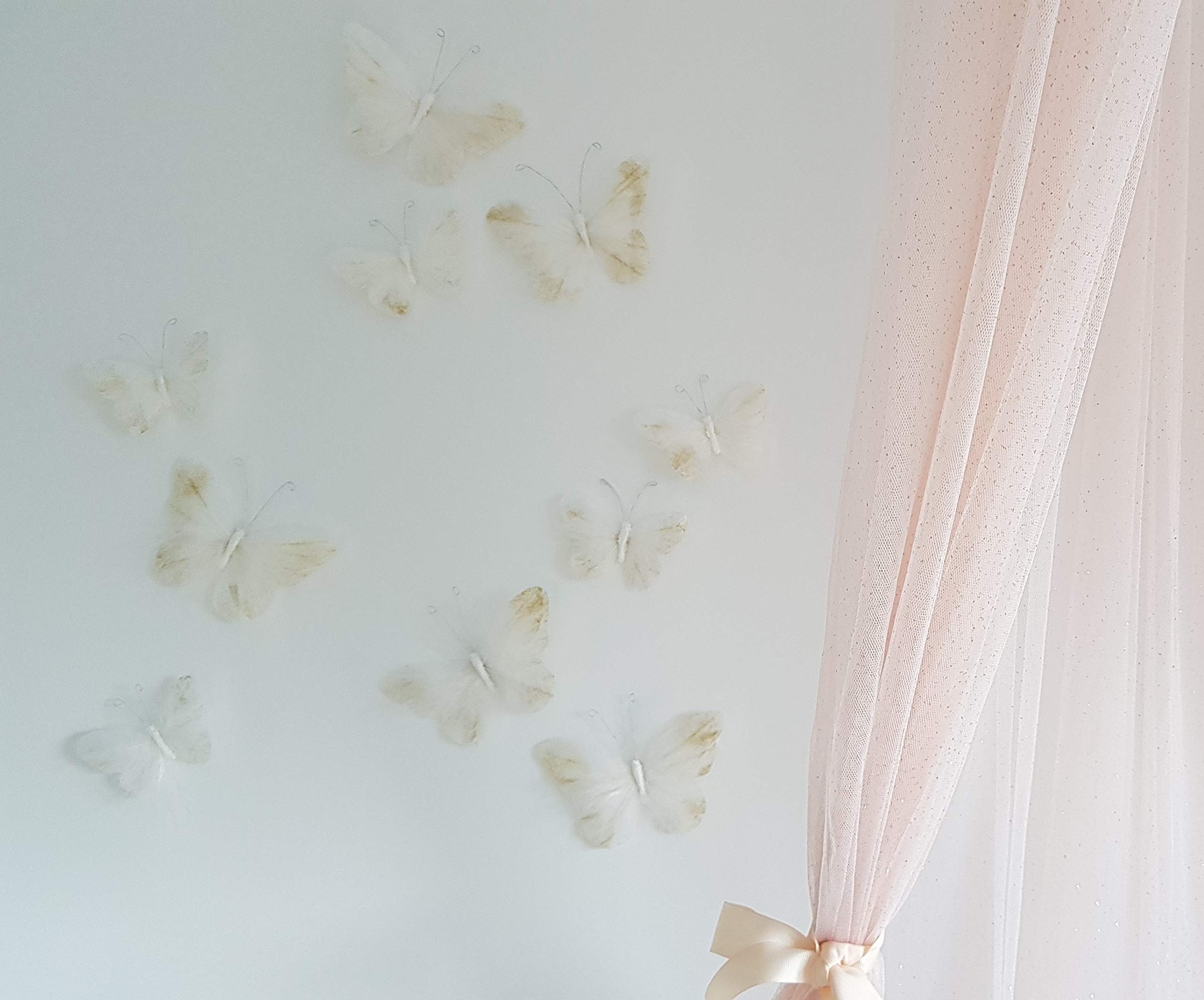 Inspired by Jewel hand-painted wings add subtle gold shimmer to walls.