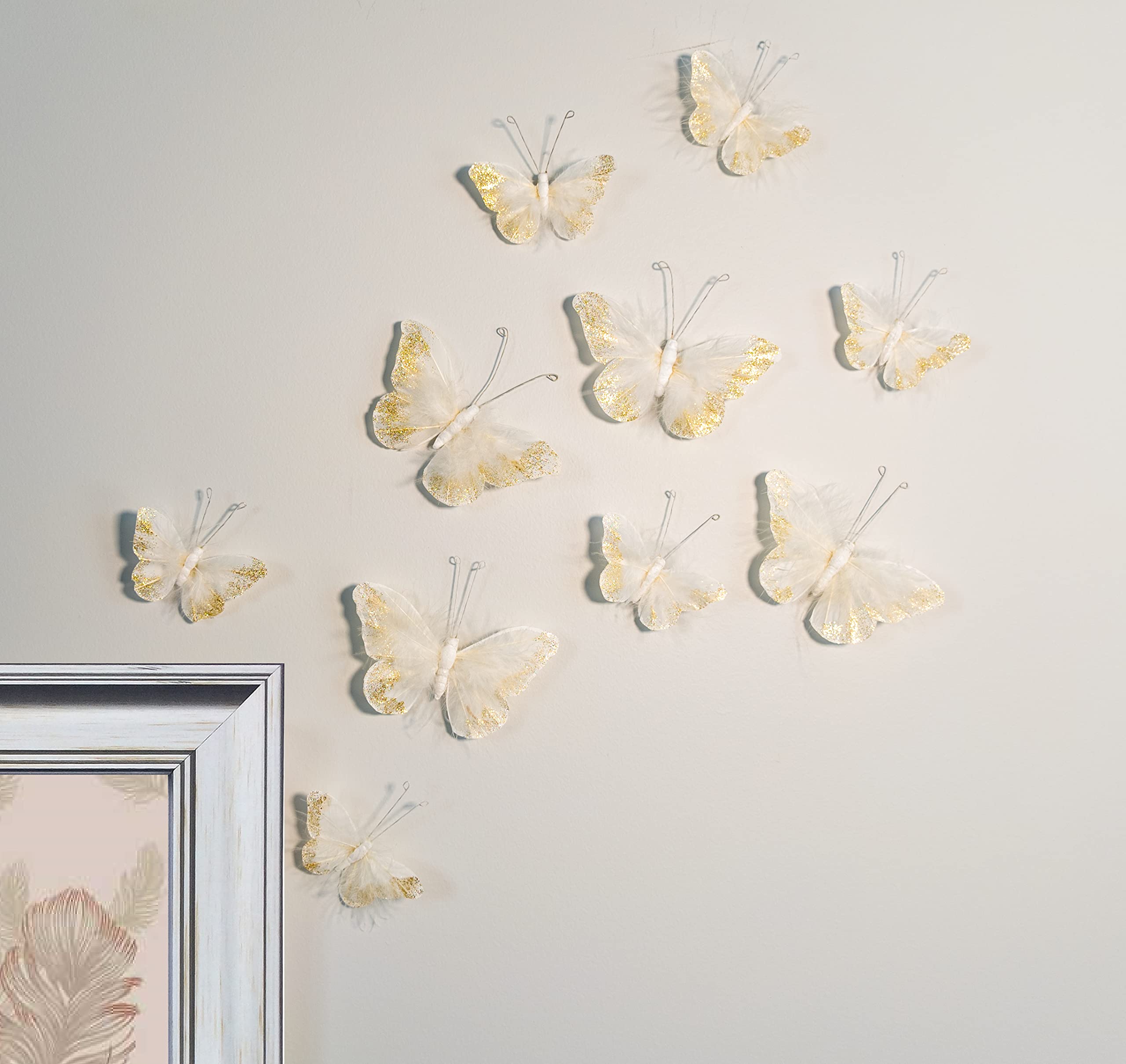 Inspired by Jewel butterfly wall decor with real feathers adds dimensional charm to any room.