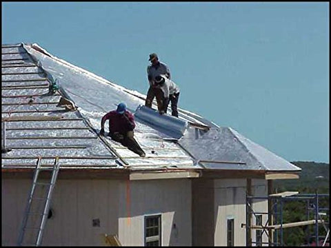 INSULATION MARKETPLACE SmartSHIELD being installed in attic with a straightedge.