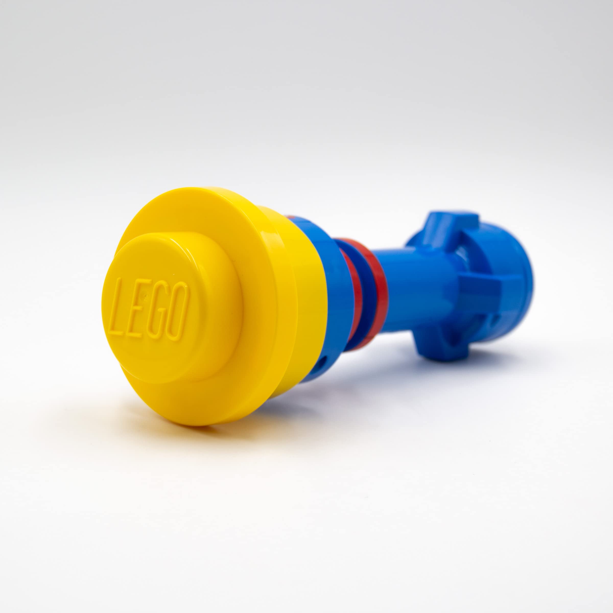 IQ Lego Iconic Torch flashlight front view in blue, red, and yellow colors.