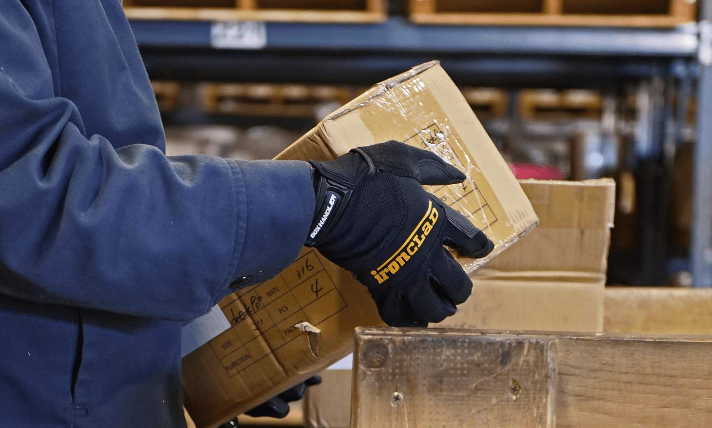Ironclad Box Handler gloves handling a cardboard box with confident grip