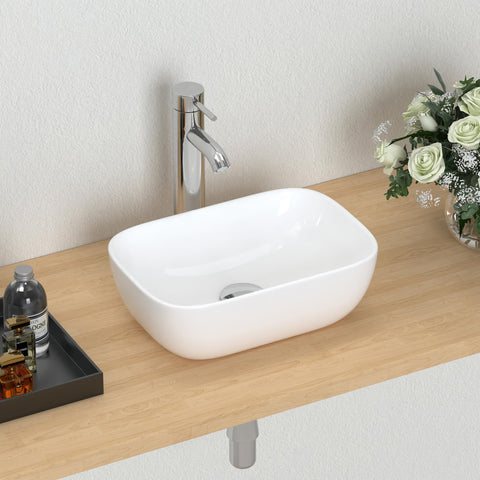 J-FAMILY small vessel sink with oval white porcelain bowl for compact bathrooms.