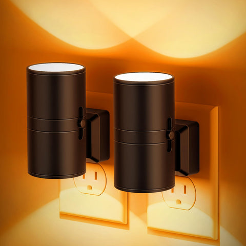 JandCase amber night light plugged into an outlet providing a guiding glow for hallways.