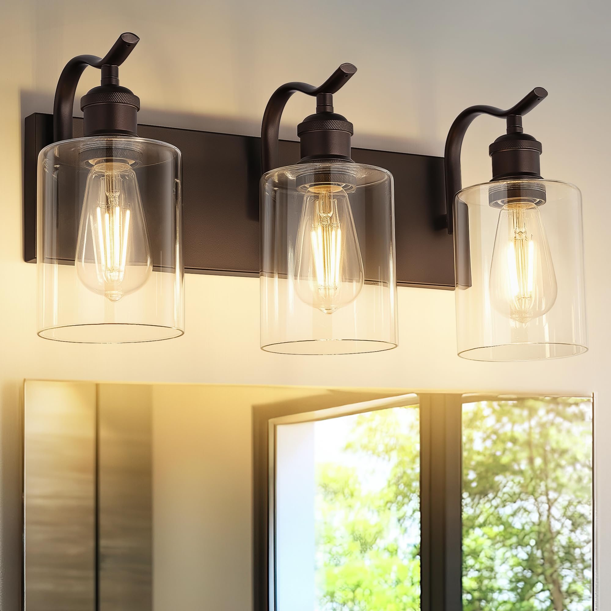 JAZAVA ZCVL01ORB-3 vanity light with bronze finish and clear glass shades for warm glow.